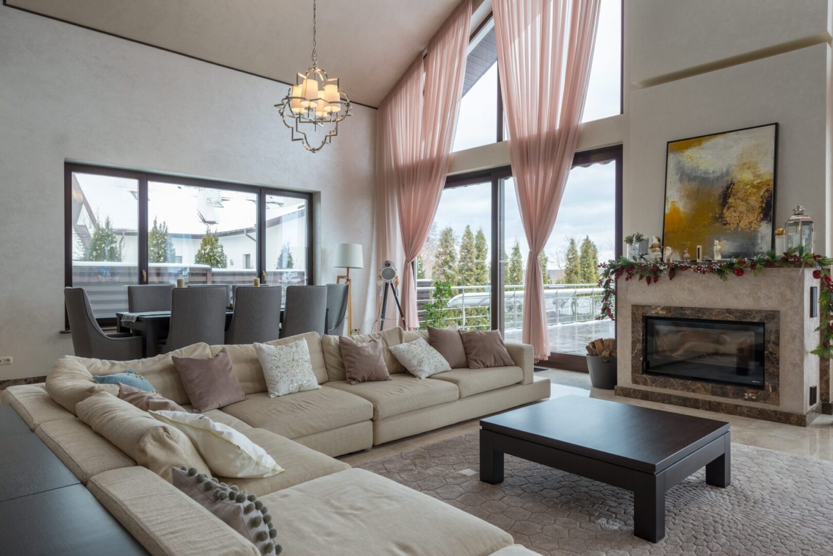 A living room with large windows and couches